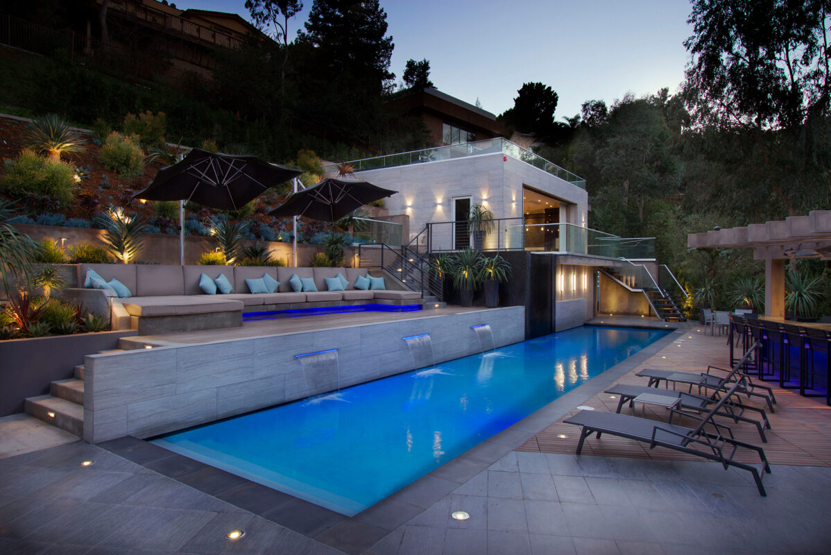 TruAudio Outdoor Audio Systems — Landscape Speakers, Kits & Burial Subs 1 Luxury backyard pool and outdoor living space designed for discreet landscape audio