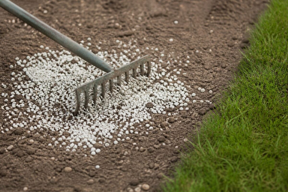 Diamond K gypsum worked into garden soil beside turf
